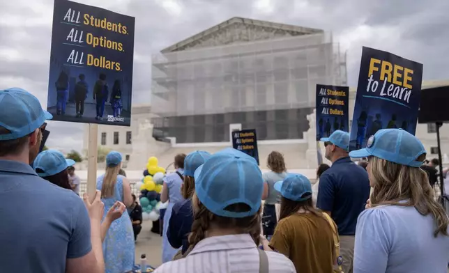 Supporters of charter schools rally outside of the Supreme Court on Wednesday, April 30, 2025, in Washington. (AP Photo/Mark Schiefelbein)