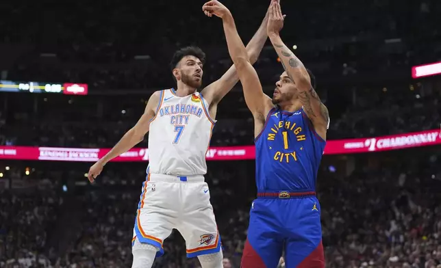 Denver Nuggets forward Michael Porter Jr., right, shoots past Oklahoma City Thunder forward Chet Holmgren, left, in the first half of Game 3 in the Western Conference semifinals of the NBA basketball playoffs Friday, May 9, 2025, in Denver. (AP Photo/David Zalubowski)