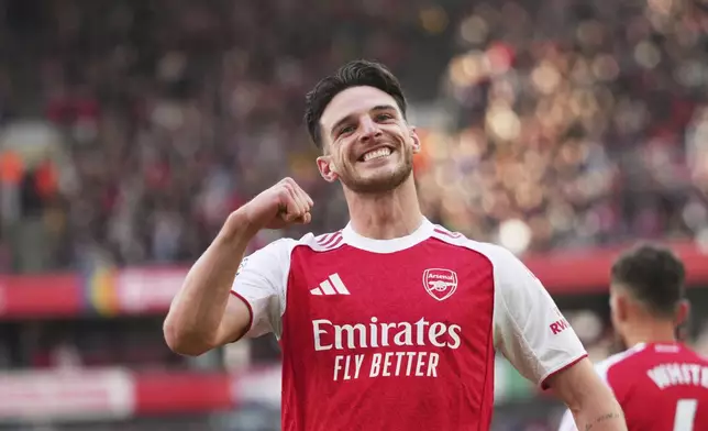 Arsenal's Declan Rice celebrates after scoring his side's opening goal during the English Premier League soccer match between Arsenal and Newcastle United at Emirates stadium in London, Sunday, May 18, 2025. (AP Photo/Kirsty Wigglesworth)