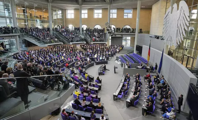 Lawmakers wait for the beginning of a session were Friedrich Merz is supposed to be elected new chancellor at the parliament Bundestag in Berlin, Tuesday, May 6, 2025. (AP Photo/Markus Schreiber)