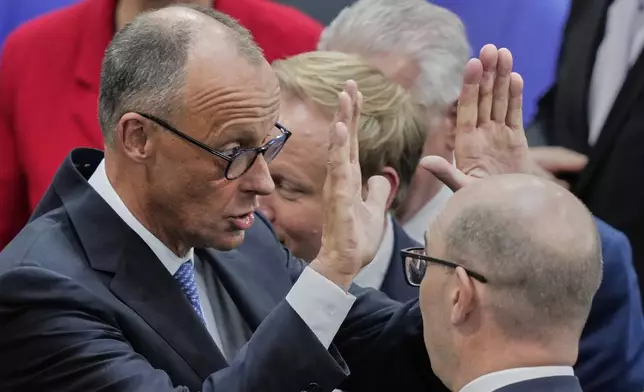 Leader of the Christian Democrats Friedrich Merz reacts after being elected new chancellor at the German federal parliament, Bundestag, at the Reichstag building in Berlin, Germany, Tuesday, May 6, 2025. (AP Photo/Ebrahim Noroozi)