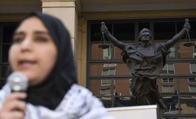 Mapheze Saleh, wife of arrested and detained Georgetown University scholar Badar Khan Suri, speaks at a news conference following her husband's hearing at Federal District Court for the Eastern District of Virginia, in Alexandria, Va., Thursday, May 1, 2025. (AP Photo/Jacquelyn Martin)