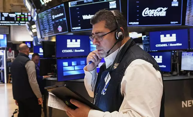 Trader Michael Capolino works on the floor of the New York Stock Exchange, Monday, May 5, 2025. (AP Photo/Richard Drew)