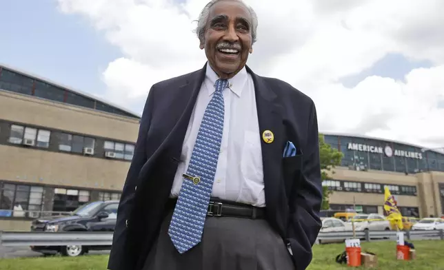 FILE - Congressman Charles Rangel leaves a rally for airport workers at LaGuardia Airport in the Queens borough of New York, June 26, 2014. (AP Photo/Seth Wenig, File)