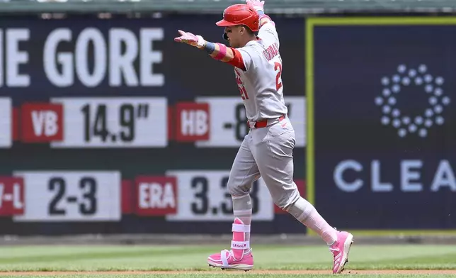 St. Louis Cardinals' Lars Nootbaar celebrates his home run as he rounds the bases during the first inning of a baseball game against the Washington Nationals, Sunday, May 11, 2025, in Washington. (AP Photo/Nick Wass)