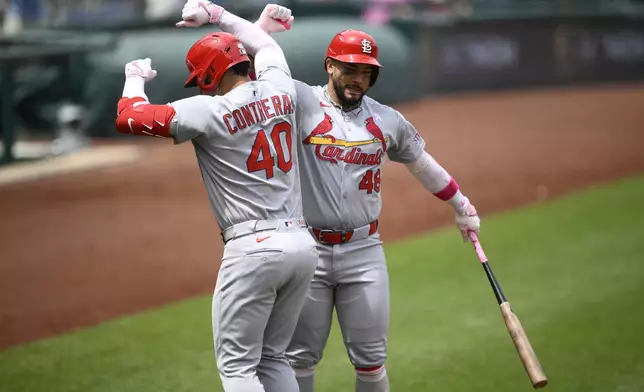 St. Louis Cardinals' Willson Contreras (40) celebrates his home run with Ivan Herrera (48) during the second inning of a baseball game against the Washington Nationals, Sunday, May 11, 2025, in Washington. (AP Photo/Nick Wass)