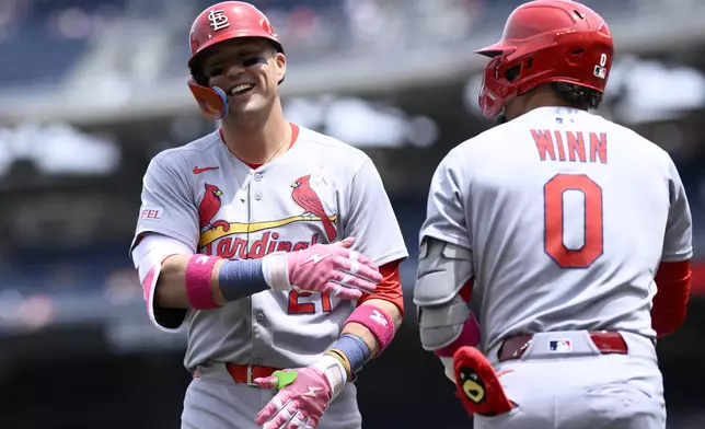 St. Louis Cardinals' Lars Nootbaar, left, celebrates his home run with Masyn Winn (0) during the first inning of a baseball game against the Washington Nationals, Sunday, May 11, 2025, in Washington. (AP Photo/Nick Wass)