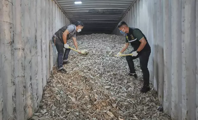 Thai officials show samples of illegally imported electronic waste from the United States which they said they seized at Bangkok Port during a press conference in Bangkok, Thailand, Wednesday, May 14, 2025. (AP Photo/Sakchai Lalit)