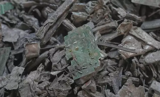 Thai officials display samples of illegally imported electronic waste from the United States which they said they seized at Bangkok Port during a press conference in Bangkok, Thailand, Wednesday, May 14, 2025. (AP Photo/Sakchai Lalit)