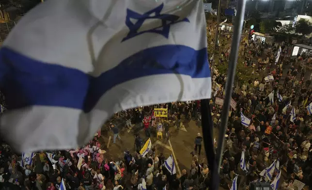 People take part in a protest demanding the end of the war and immediate release of hostages held by Hamas in the Gaza Strip, and against Prime Minister Benjamin Netanyahu's government in Tel Aviv, Israel, Saturday, May 3, 2025.(AP Photo/Ariel Schalit)