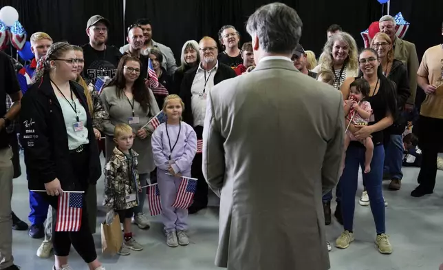 Deputy Secretary of State Christopher Landau greets Afrikaner refugees from South Africa, Monday, May 12, 2025, at Dulles International Airport in Dulles, Va. (AP Photo/Julia Demaree Nikhinson)