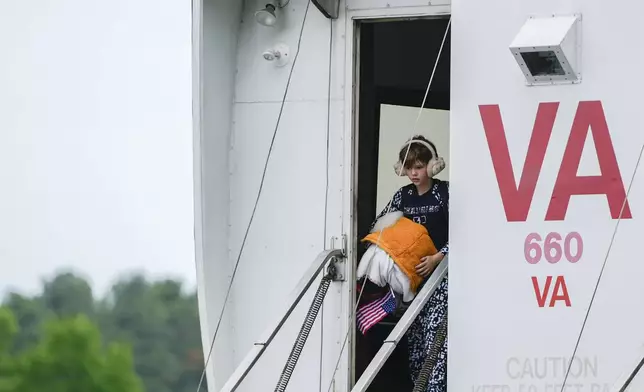 A young Afrikaner refugee from South Africa arrives, Monday, May 12, 2025, at Dulles International Airport in Dulles, Va. (AP Photo/Julia Demaree Nikhinson)