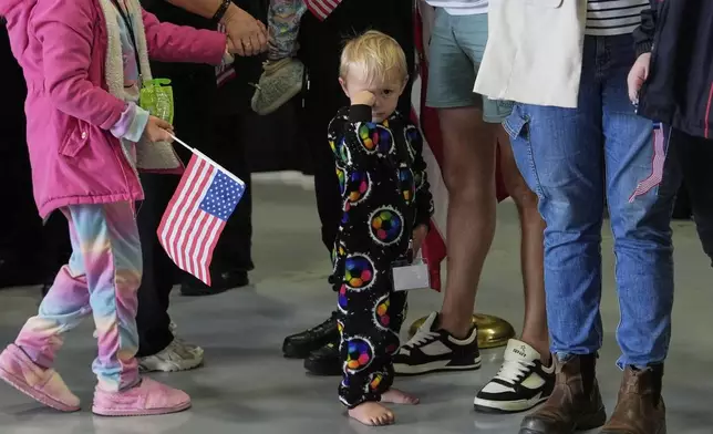A young Afrikaner refugees from South Africa arrives, Monday, May 12, 2025, at Dulles International Airport in Dulles, Va. (AP Photo/Julia Demaree Nikhinson)