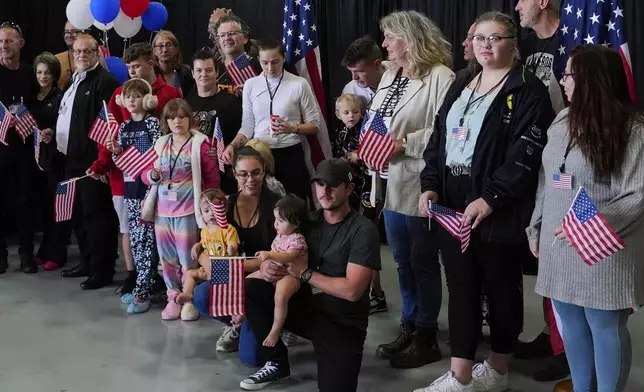 Afrikaner refugees from South Africa arrive, Monday, May 12, 2025, at Dulles International Airport in Dulles, Va. (AP Photo/Julia Demaree Nikhinson)