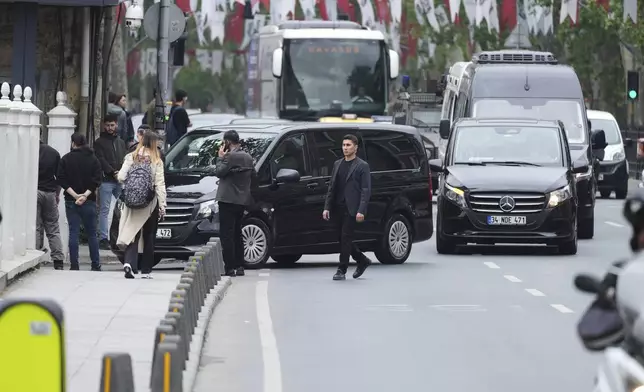 Vehicles begin arriving outside a gate prior to expected talks between Russian and Ukrainian delegations at the Dolmabache palace, in Istanbul, Turkey, Friday, May 16, 2025. (AP Photo/Dilara Acikgoz)