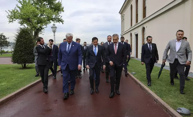 In this handout photo released by Turkish Foreign Ministry, front from left, Ukraine's Foreign Minister Andrii Sybiha, U.S. Secretary of State Marco Rubio and Turkish Foreign Minister Hakan Fidan arrive for a meeting at Dolmabahce palace in Istanbul, Turkey, Friday, May 16, 2025. (Turkish Foreign Ministry via AP)