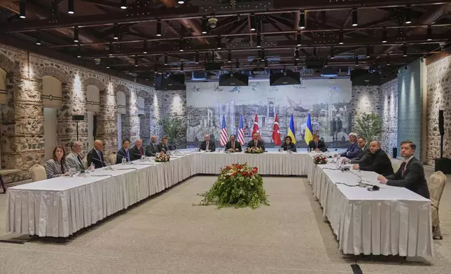 Delegations from U.S, left, led by U.S. Secretary of State Marco Rubio, fourth left, Turkey, center, led by Turkish Foreign Minister Hakan Fidan, center, and Ukraine, right, led by Ukraine's Minister of Foreign Affairs Andrii Sybiha, fourth right, and Ukraine's Defence Minister Rustem Umerov, second right, gather for a meeting at Dolmabahce palace, in Istanbul, Turkey, Friday, May 16, 2025. (AP Photo/Francisco Seco, Pool)