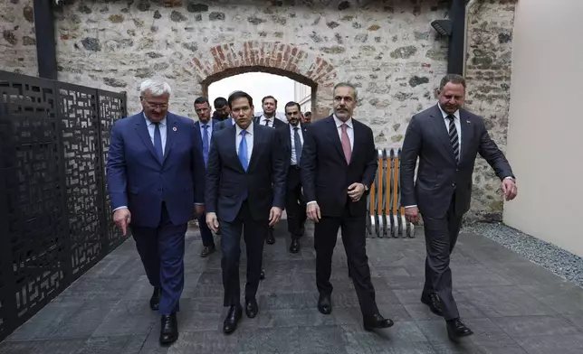 In this handout photo released by Turkish Foreign Ministry, from left, Ukraine's Foreign Minister Andrii Sybiha, U.S. Secretary of State Marco Rubio, Turkish Foreign Minister Hakan Fidan and Ukrainian Head of Presidential Office Andriy Yermak arrive for a meeting at Dolmabahce palace in Istanbul, Turkey, Friday, May 16, 2025. (Turkish Foreign Ministry via AP)