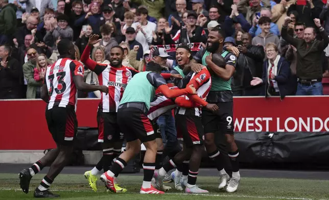 Brentford's Yoane Wissa, second right, celebrates scoring their side's fourth goal of the game during the English Premier League soccer match between Brentford and Manchester United at the Gtech Community Stadium, London, Sunday, May 4, 2025. (John Walton/PA via AP)
