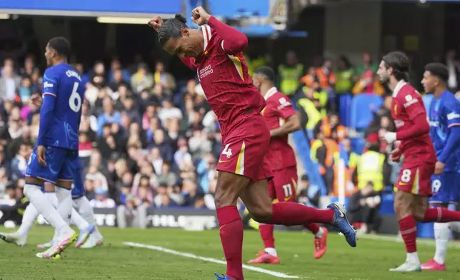 Liverpool's Virgil van Dijk celebrates scoring his side's first goal during the English Premier League soccer match between Chelsea and Liverpool at Stamford Bridge stadium in London, Sunday, May 4, 2025. (AP Photo/Kin Cheung)