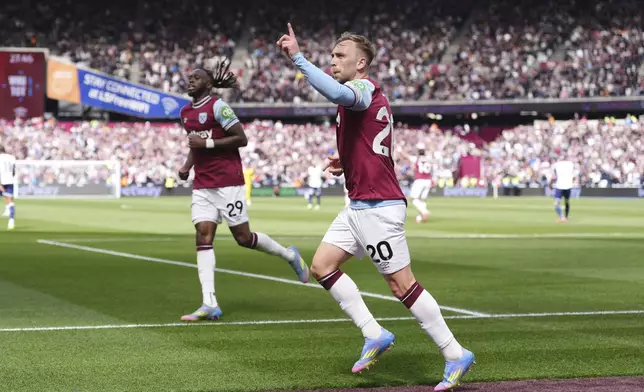 West Ham United's Jarrod Bowen celebrates scoring his side's first goal of the game, during the English Premier League soccer match between West Ham United and Tottenham Hotspur, at the London Stadium, in London, Sunday May 4, 2025. (Bradley Collyer/PA via AP)