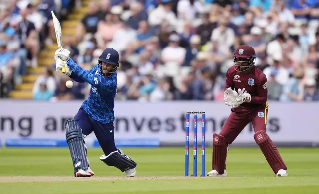 England's Ben Duckett, left, bats during the First Men's One Day International match between England and West Indies at Edgbaston, Birmingham, England, Thursday May 29, 2025. (Nick Potts/PA via AP)
