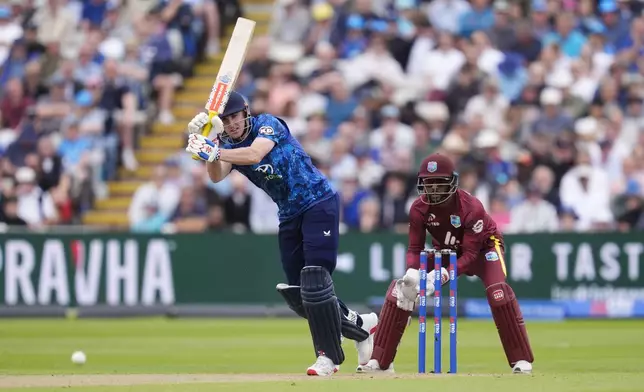 England's Harry Brook, left, bats during the First Men's One Day International match between England and West Indies at Edgbaston, Birmingham, England, Thursday May 29, 2025. (Nick Potts/PA via AP)