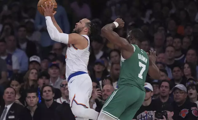 New York Knicks' Jalen Brunson, left, drives past Boston Celtics' Jaylen Brown (7) during the second half of Game 6 in the Eastern Conference semifinals of the NBA basketball playoffs Friday, May 16, 2025, in New York. (AP Photo/Frank Franklin II)