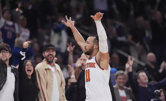 New York Knicks' Jalen Brunson (11) gestures to fans during the second half of Game 6 in the Eastern Conference semifinals of the NBA basketball playoffs against the Boston Celtics Friday, May 16, 2025, in New York. (AP Photo/Frank Franklin II)