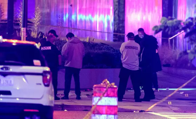 Law enforcement work the scene after two staff members of the Israeli Embassy in Washington were shot and killed outside the Capital Jewish Museum, Thursday, May 22, 2025, in Washington.. (AP Photo/Rod Lamkey, Jr.)