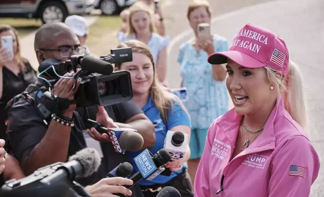 Savannah Chrisley, daughter of reality television star Todd Chrisley, speaks outside the Federal Prison Camp, Wednesday, May 28, 2025, in Pensacola, Fla. (AP Photo/Dan Anderson)