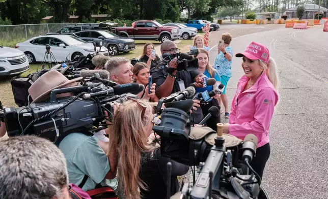 Savannah Chrisley, daughter of reality television star Todd Chrisley, speaks outside the Federal Prison Camp, Wednesday, May 28, 2025, in Pensacola, Fla. (AP Photo/Dan Anderson)