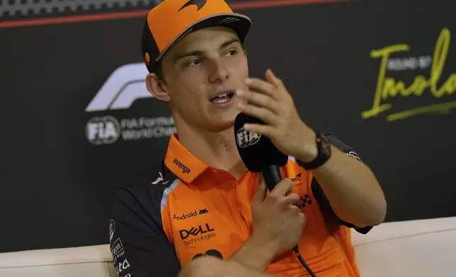 McLaren driver Oscar Piastri of Australia answers reporters during a news conference at the Enzo and Dino Ferrari racetrack, ahead the Italy's Emilia Romagna Formula One Grand Prix in Imola, Italy, Thursday, May 15, 2025. (AP Photo/Luca Bruno)