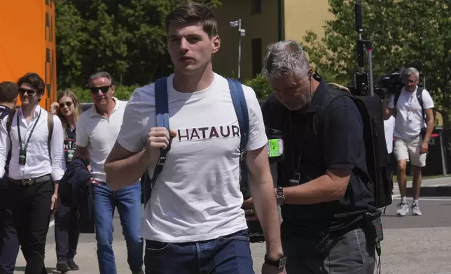 Red Bull driver Max Verstappen of the Netherlands arrives in the paddock at the Enzo and Dino Ferrari racetrack, ahead the Italy's Emilia Romagna Formula One Grand Prix in Imola, Italy, Thursday, May 15, 2025. (AP Photo/Antonio Calanni)