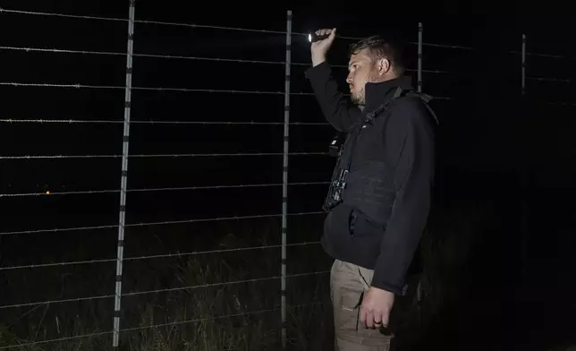 Dewet Ungerer, AfriForum coordinator, patrols a road during a neighborhood and farm security watch operation in the east of Pretoria, South Africa, Thursday, March 29, 2025. (AP Photo/Alet Pretorius)
