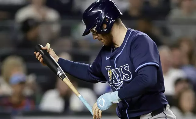 Tampa Bay Rays' Danny Jansen reacts after striking out during the eighth inning of a baseball game against the New York Yankees, Friday, May 2, 2025, in New York. (AP Photo/Adam Hunger)