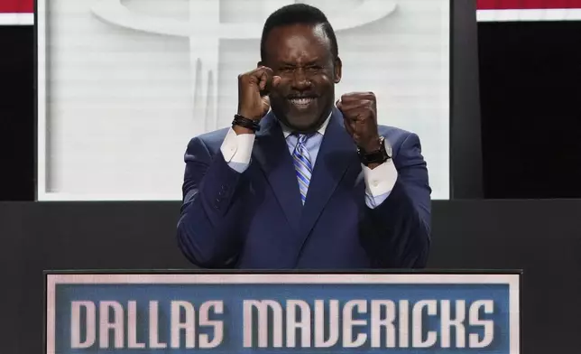 Dallas Mavericks' Rolando Blackman celebrates after NBA Deputy Commissioner Mark Tatum announced that the Mavericks won the first pick in the NBA basketball draft lottery in Chicago, Monday, May 12, 2025. (AP Photo/Nam Y. Huh)