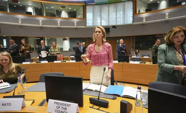 European Union foreign policy chief Kaja Kallas, center, rings a bell to signify the start of a meeting of EU defense ministers at the European Council building in Brussels, Tuesday, May 20, 2025. (AP Photo/Virginia Mayo)