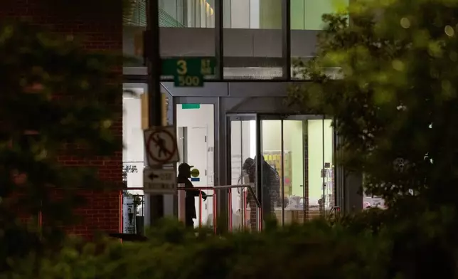 Law enforcement work the scene after two staff members of the Israeli Embassy in Washington were shot and killed outside the Capital Jewish Museum, Thursday, May 22, 2025, in Washington. (AP Photo/Rod Lamkey, Jr.)