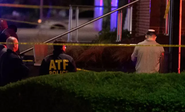 Law enforcement work the scene after two staff members of the Israeli Embassy in Washington were shot and killed outside the Capital Jewish Museum, Thursday, May 22, 2025, in Washington.. (AP Photo/Rod Lamkey, Jr.)