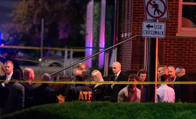 Attorney General Pam Bondi, center, walks to her car as law enforcement work the scene after two staff members of the Israeli Embassy in Washington were shot and killed outside the Capital Jewish Museum, Thursday, May 22, 2025, in Washington. (AP Photo/Rod Lamkey, Jr.)