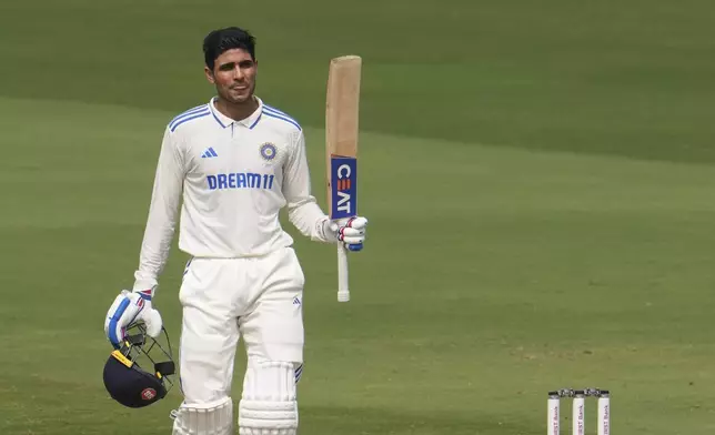FILE -India's Shubman Gill celebrates his century on the third day of the second test match between India and England, in Visakhapatnam, India, Feb. 4, 2024. (AP Photo/Manish Swarup, File)