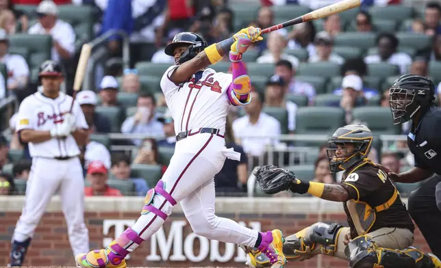 Atlanta Braves' Ronald Acuna Jr. hits a double in the fifth inning of a baseball game against the San Diego Padres, Sunday, May 25, 2025, in Atlanta. (AP Photo/Colin Hubbard)