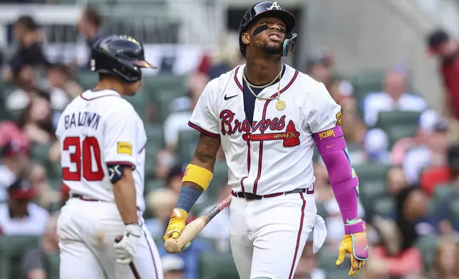 Atlanta Braves' Ronald Acuna Jr. reacts after striking out in the third inning of a baseball game against the San Diego Padres, Sunday, May 25, 2025, in Atlanta. (AP Photo/Colin Hubbard)