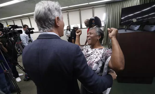 The mother of Tiffany Slaton, Fredrina, reacts to her daughter being found in the High Sierra after going missing for three weeks, during a press conference, Friday, May 16, 2025 in Fresno, Calif. (AP Photo/Gary Kazanjian)