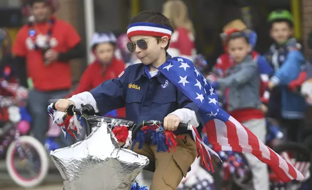Samuel Shorto,6, of Westmont participates in a Memorial Day bicycle contest in Johnstown, PA., Monday, May 26, 2025. (John Rucosky/The Tribune-Democrat via AP)