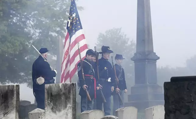 Members of the 54th Pa. Volunteer Infantry, Co. A, conduct an annual salute to Civil War union veteran Col. Jacob Campbell at Grandview Cemetery in johnstown, Pa., Monday, May 26, 2025. (John Rucosky/The Tribune-Democrat via AP)
