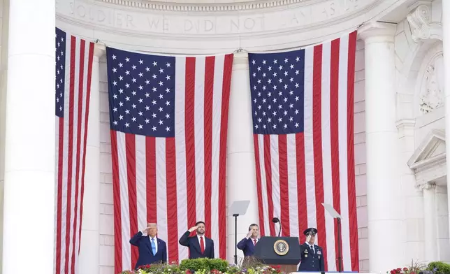 President Donald Trump, from left, Vice President JD Vance, Secretary of Defense Pete Hegseth and Chairman of the Joint Chiefs of Staff, U.S. Air Force Gen. Dan Caine, right, salute during the 157th National Memorial Day Observance at Arlington National Cemetery, Monday, May 26, 2025, in Arlington, Va. (AP Photo/Jacquelyn Martin)