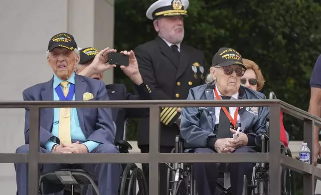 Veterans listen to President Donald Trump speak during the 157th National Memorial Day Observance at Arlington National Cemetery, Monday, May 26, 2025, in Arlington, Va. (AP Photo/Jacquelyn Martin)