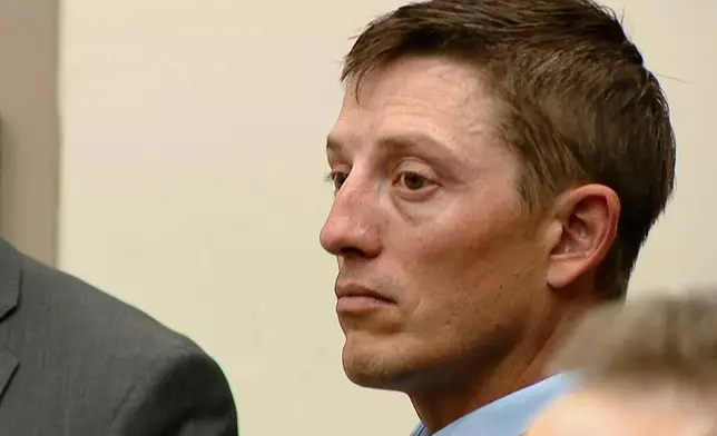 Former Grand Rapids Police officer Christopher Schurr sits in court during the second day of his trial at the Kent County Courthouse in Grand Rapids, Mich., Tuesday, April 29, 2025. Schurr is charged with second-degree murder in the fatal shooting of Patrick Lyoya, a 26-year-old Congolese immigrant during a traffic stop on April 4, 2022. (WOOD-TV via AP, Pool)